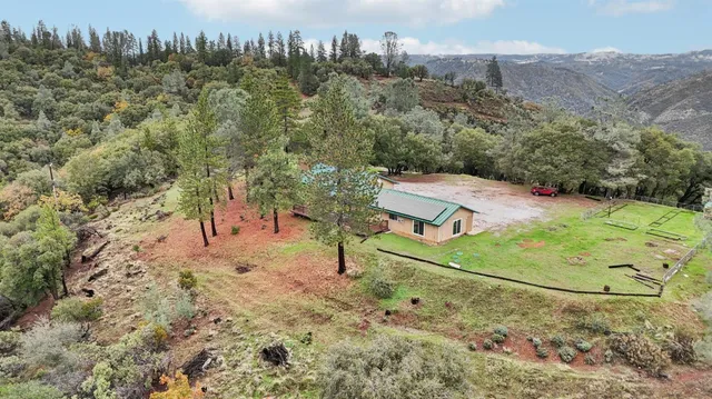 a backyard of a house with lots of green space