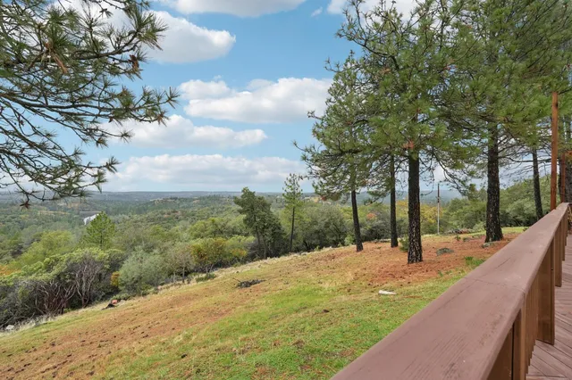 a view of livingroom with furniture flat screen tv and staircase