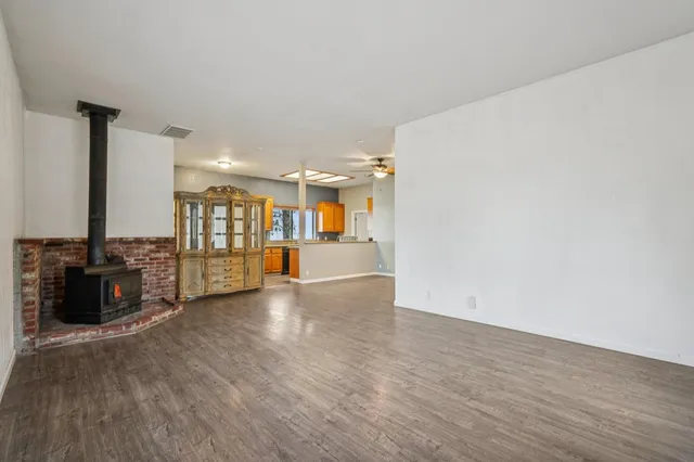 wooden floor in kitchen and a room with wooden floor