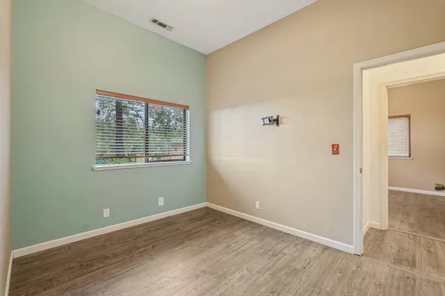 a view of a livingroom with furniture and a window