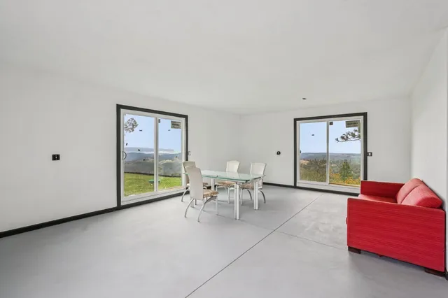 a living room with furniture a window and a table