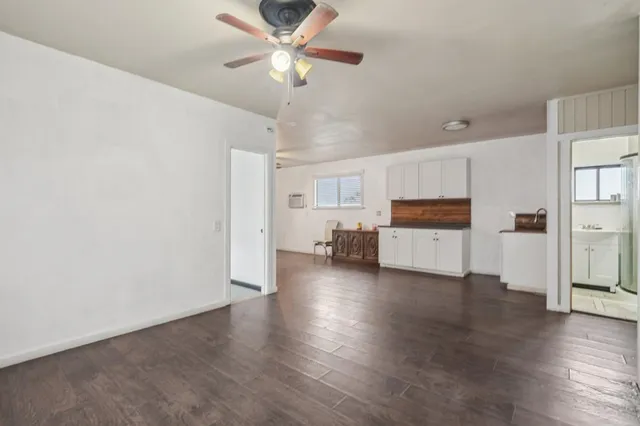 a view of a kitchen with a sink and a window