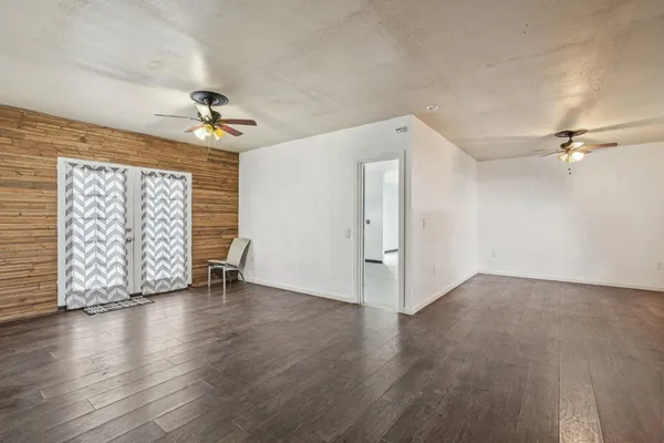 a view of balcony with wooden floor and fence and floor