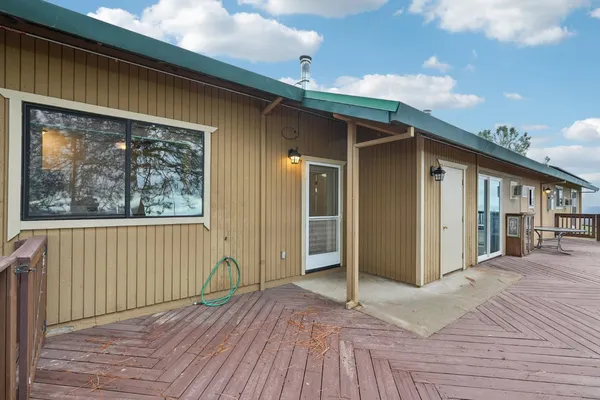 a view of balcony and wooden floor