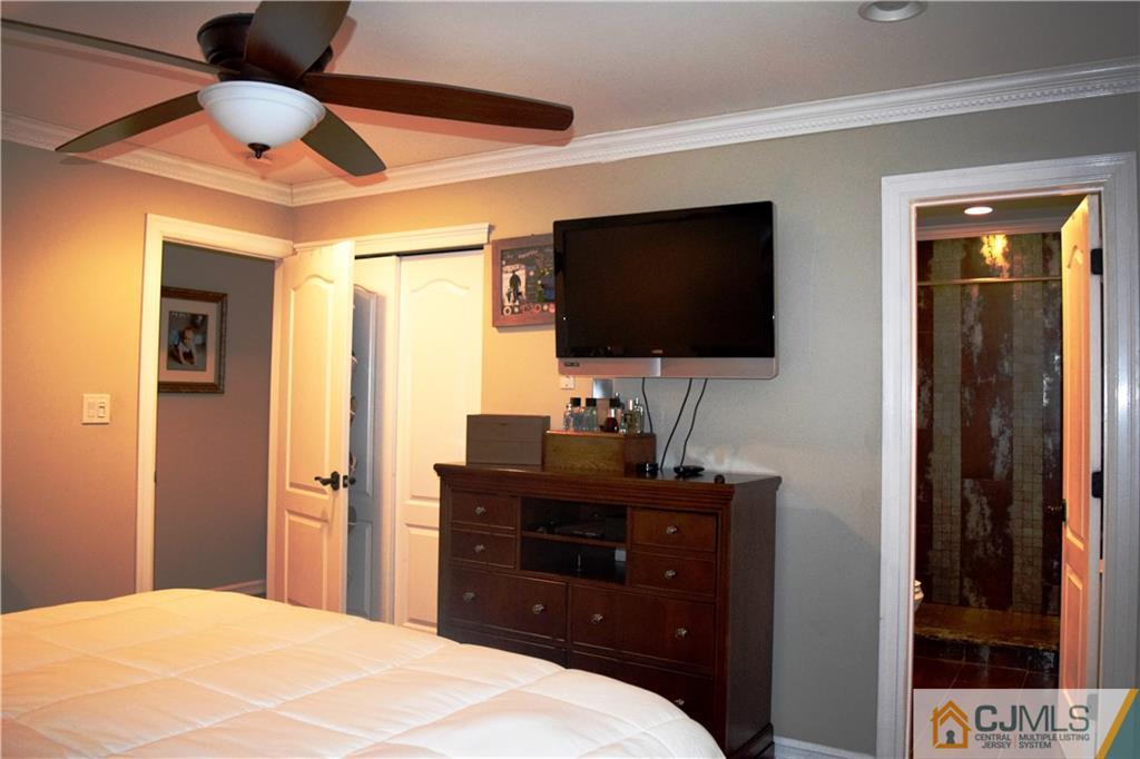 10 Fordham Road Old Bridge, NJ 08859 - Photo 13 of 26 a bedroom with a bed and a flat screen tv