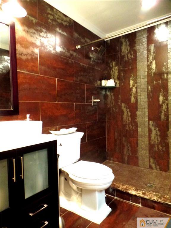 10 Fordham Road Old Bridge, NJ 08859 - Photo 14 of 26 a bathroom with a toilet and shower