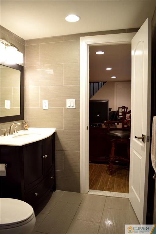 10 Fordham Road Old Bridge, NJ 08859 - Photo 18 of 26 a bathroom with a sink and a mirror