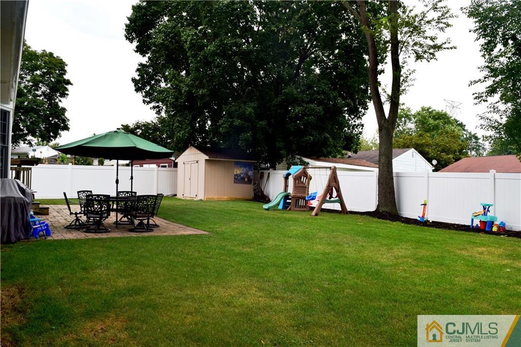 10 Fordham Road Old Bridge, NJ 08859 - Photo 24 of 26 a view of a white house with a yard and sitting area