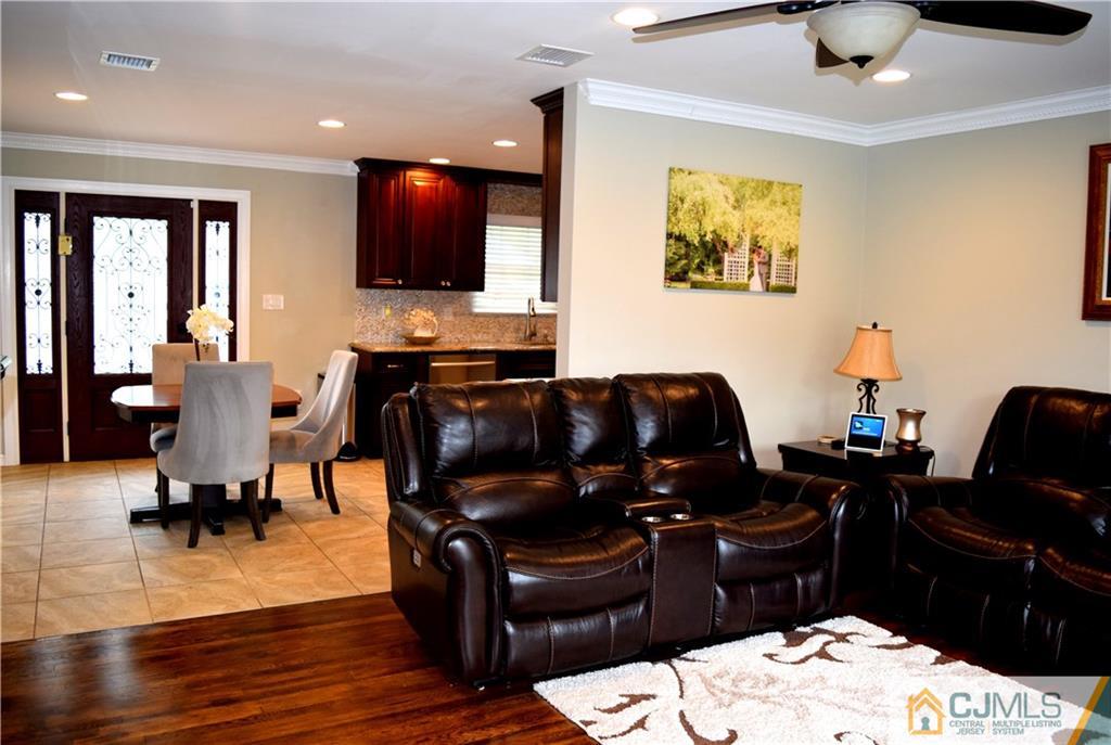 10 Fordham Road Old Bridge, NJ 08859 - Photo 8 of 26 a living room with furniture and a flat screen tv
