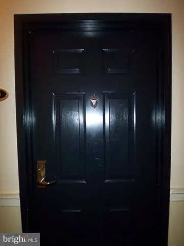 a kitchen with granite countertop stainless steel appliances a stove a microwave a sink and cabinets