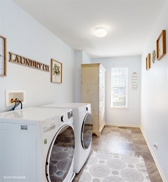 25613 West Cerena Circle Plainfield, IL 60586 - Photo 13 of 28 a utility room with dryer and washer