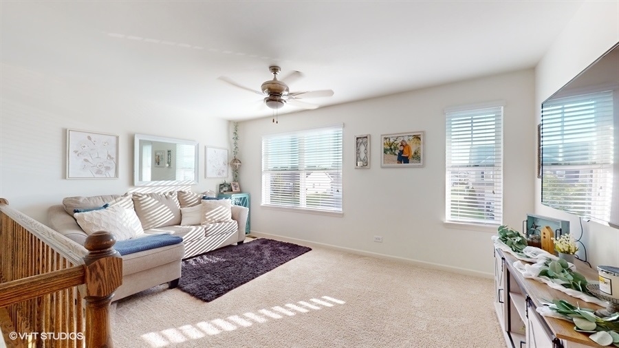 25613 West Cerena Circle Plainfield, IL 60586 - Photo 14 of 28 a living room with furniture and a window