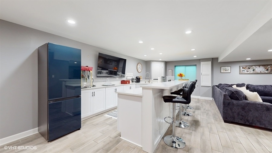 25613 West Cerena Circle Plainfield, IL 60586 - Photo 20 of 28 a living room with furniture and a flat screen tv