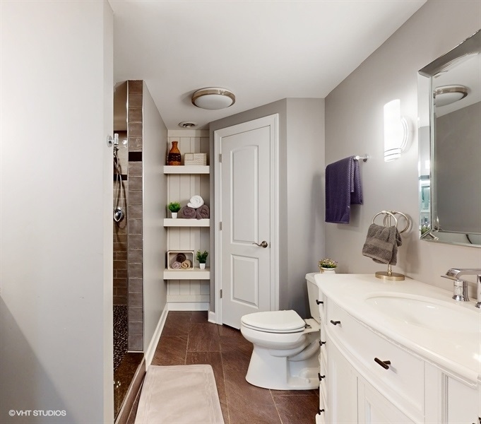 25613 West Cerena Circle Plainfield, IL 60586 - Photo 21 of 28 a bathroom with a sink a toilet and shower