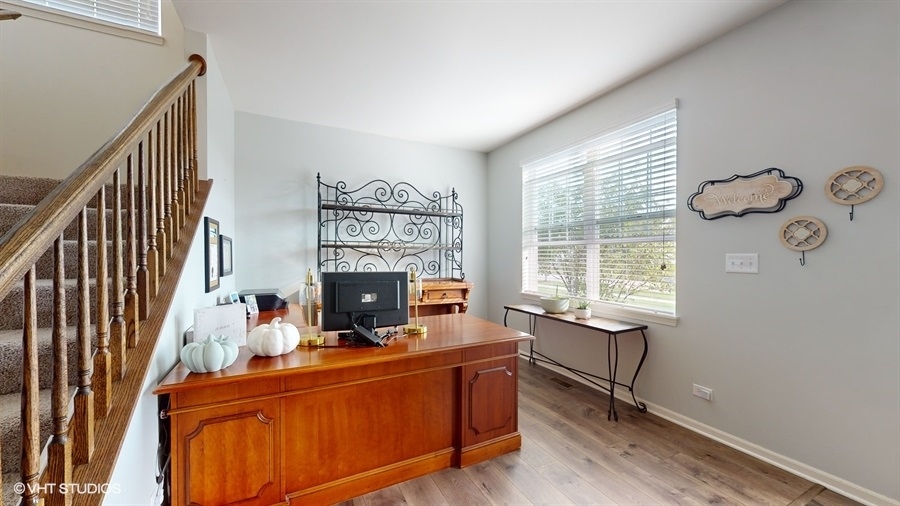 25613 West Cerena Circle Plainfield, IL 60586 - Photo 7 of 28 a view of a workspace with furniture and a window