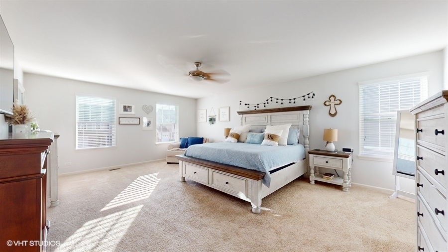 25613 West Cerena Circle Plainfield, IL 60586 - Photo 10 of 28 a bedroom with a bed and a dresser