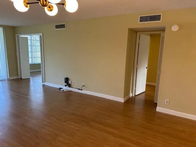 a view of a livingroom with wooden floor