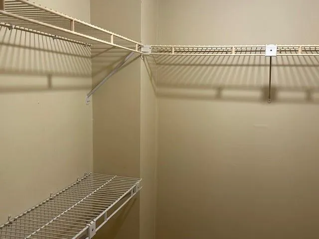 a view of a room with racks on the wall