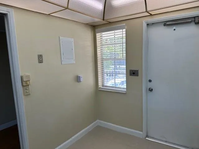 a metallic refrigerator freezer sitting in a kitchen