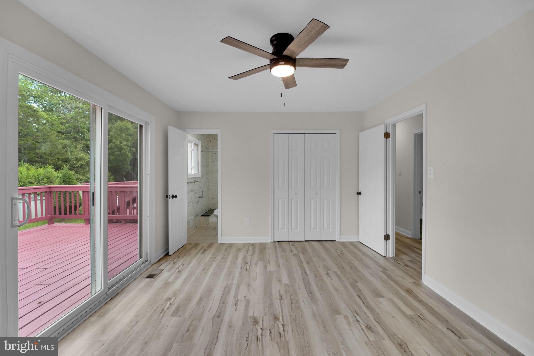 8613 Weems Road Manassas, VA 20110 - Photo 13 of 50 a view of empty room with wooden floor and fan