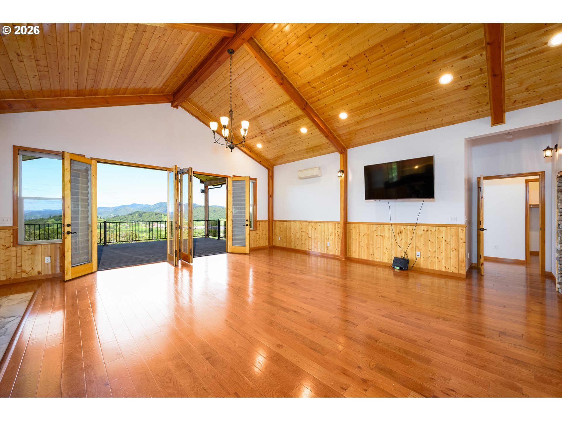 1757 Riddle Bypass Road Riddle, OR 97469 - Photo 12 of 48 a view of an empty room with glass door and windows