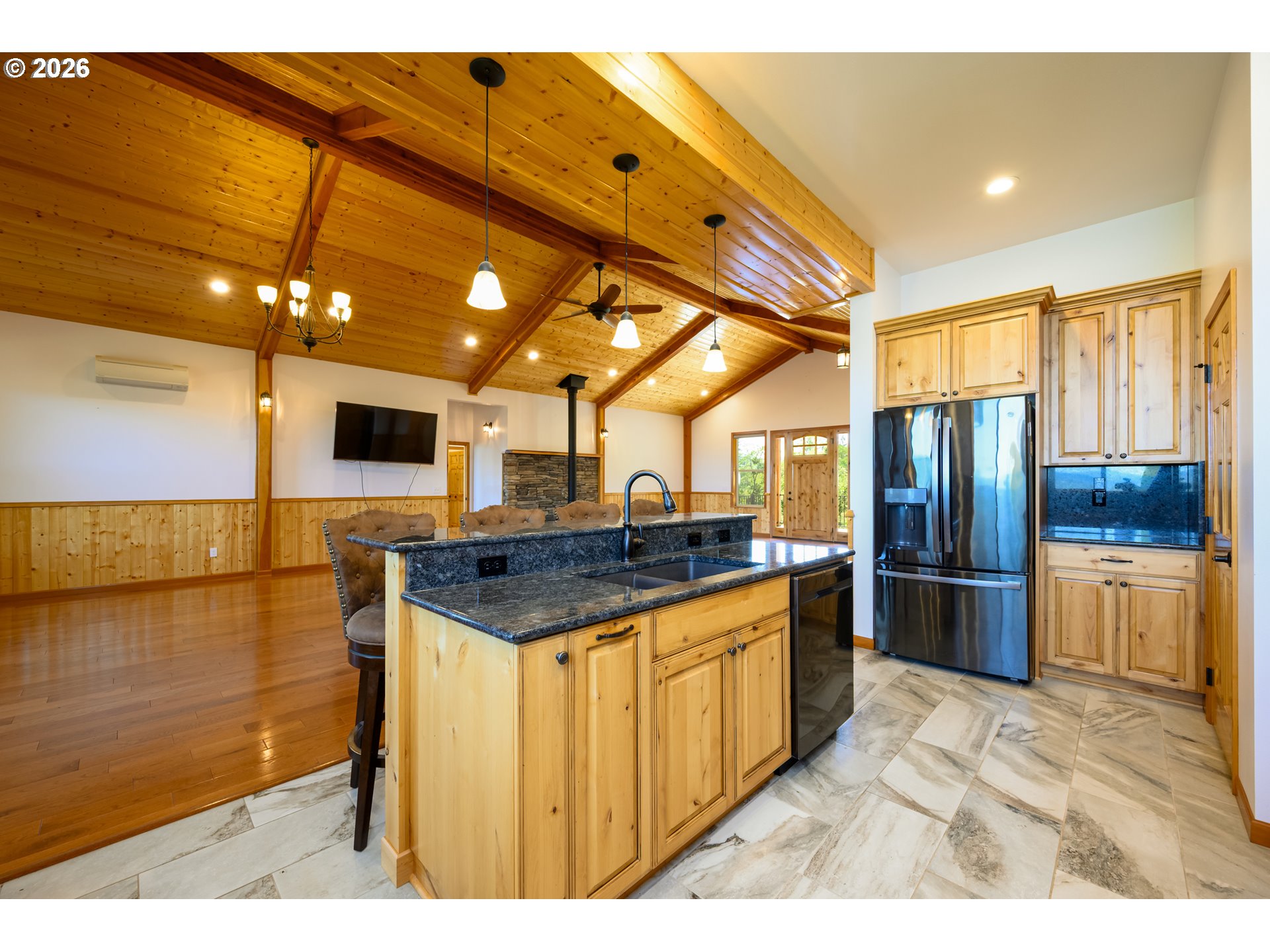 1757 Riddle Bypass Road Riddle, OR 97469 - Photo 14 of 48 a kitchen with stainless steel appliances kitchen island granite countertop a sink and cabinets