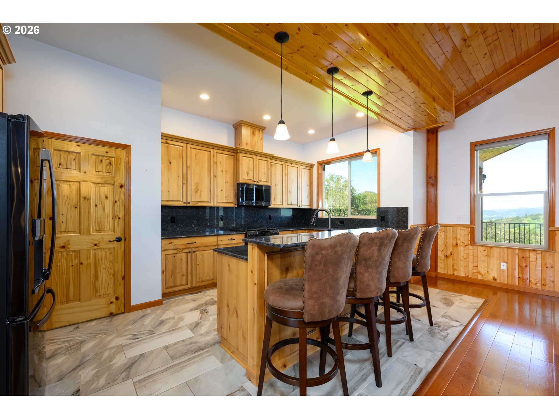 1757 Riddle Bypass Road Riddle, OR 97469 - Photo 15 of 48 a open kitchen with a table and chairs