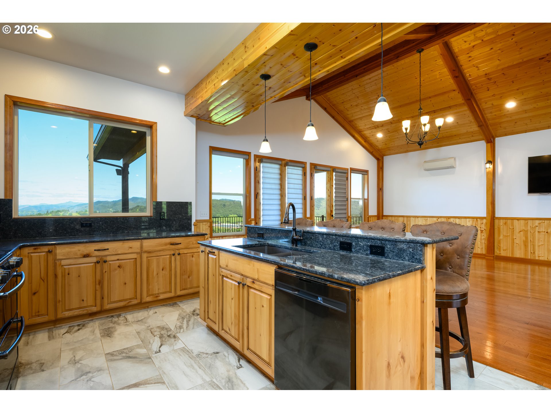 1757 Riddle Bypass Road Riddle, OR 97469 - Photo 17 of 48 a kitchen with stainless steel appliances granite countertop a sink and cabinets
