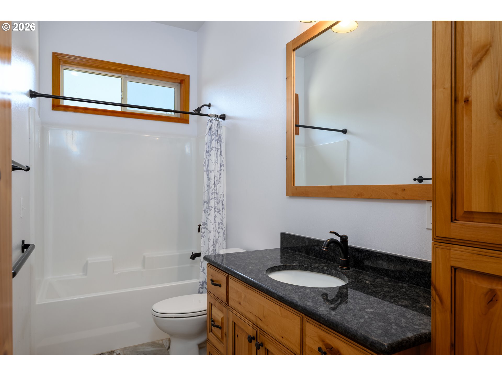 1757 Riddle Bypass Road Riddle, OR 97469 - Photo 22 of 48 a bathroom with a granite countertop sink toilet and shower