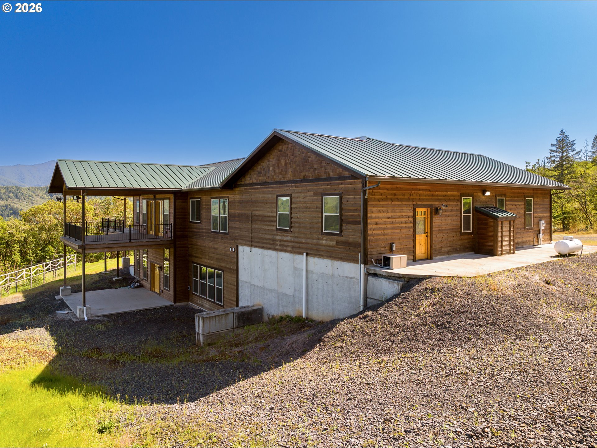 1757 Riddle Bypass Road Riddle, OR 97469 - Photo 42 of 48 a front view of a house with a yard
