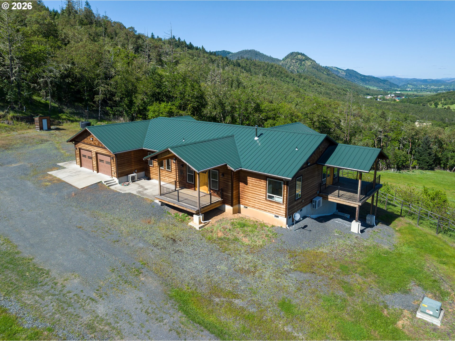 1757 Riddle Bypass Road Riddle, OR 97469 - Photo 43 of 48 an aerial view of a house with a garden and a yard
