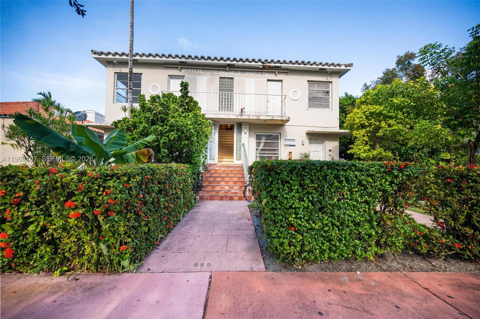 825 Alton Road, Unit 8 Miami Beach, FL 33139 - Photo 11 of 11 a front view of a house with a yard