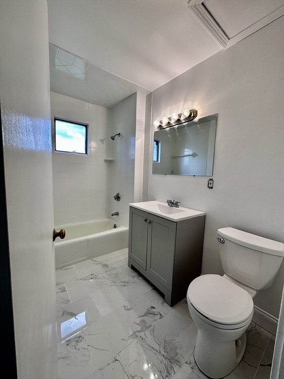 90 Brook Road, Unit 1R Quincy, MA 02169 - Photo 4 of 5 a bathroom with a sink toilet and shower