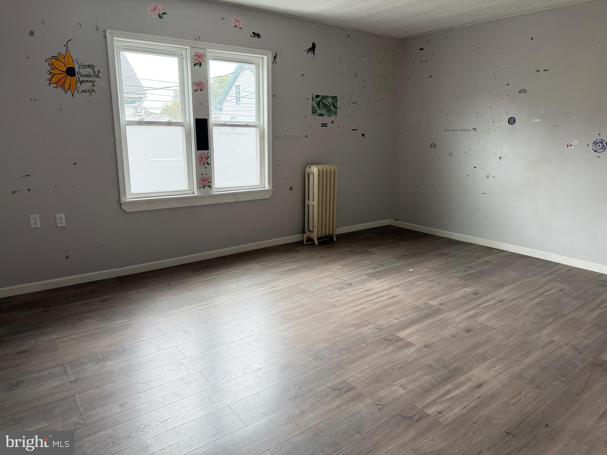 125 South Main Street Manheim, PA 17545 - Photo 19 of 27 an empty room with wooden floor and windows