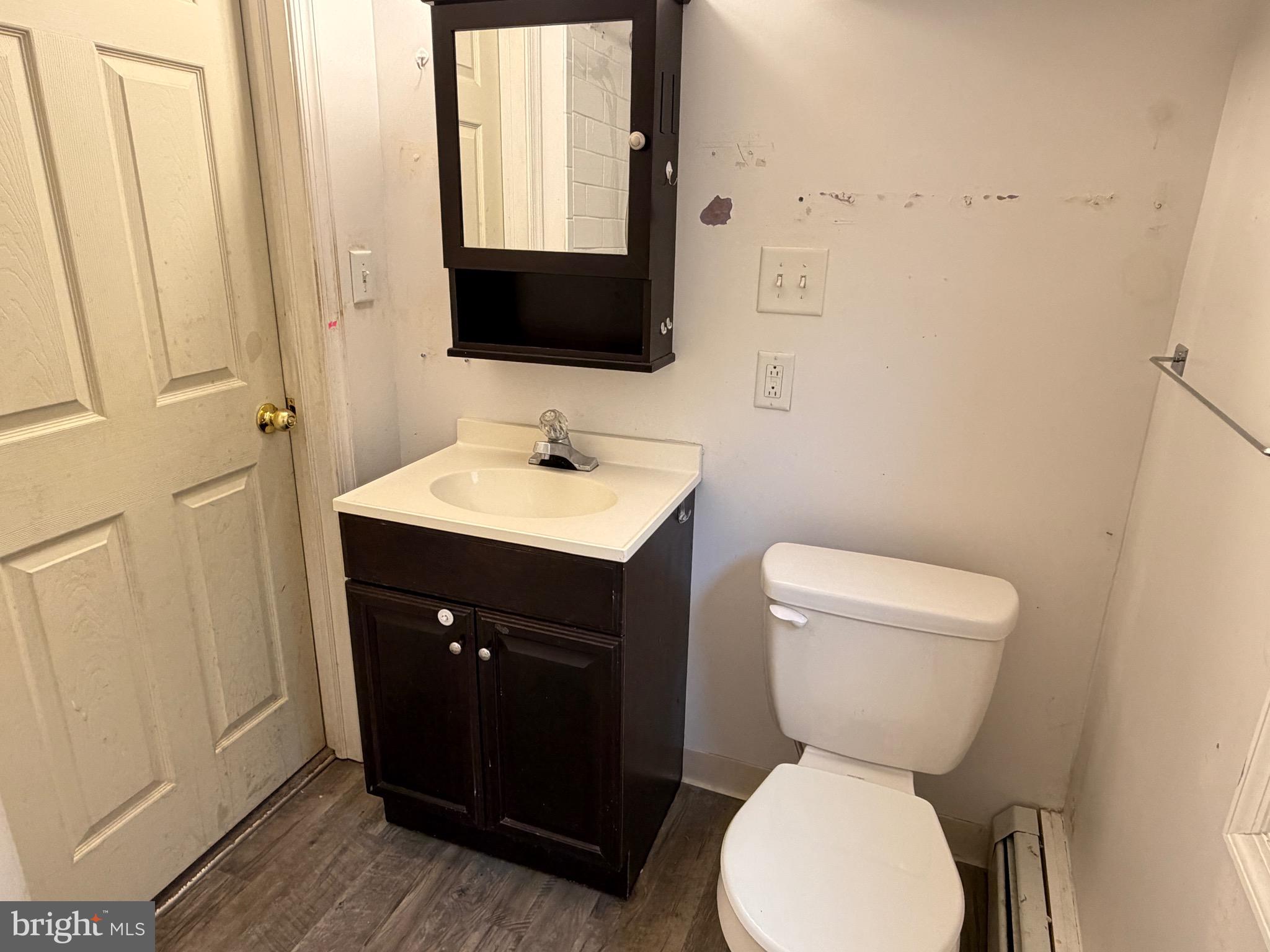 125 South Main Street Manheim, PA 17545 - Photo 23 of 27 a bathroom with a toilet sink and mirror