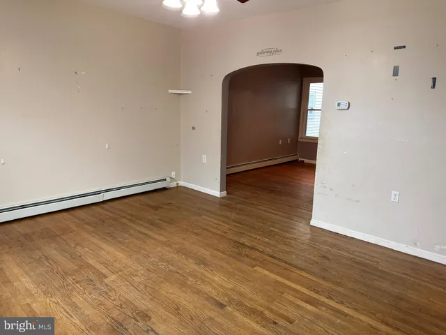 a view of a livingroom with wooden floor