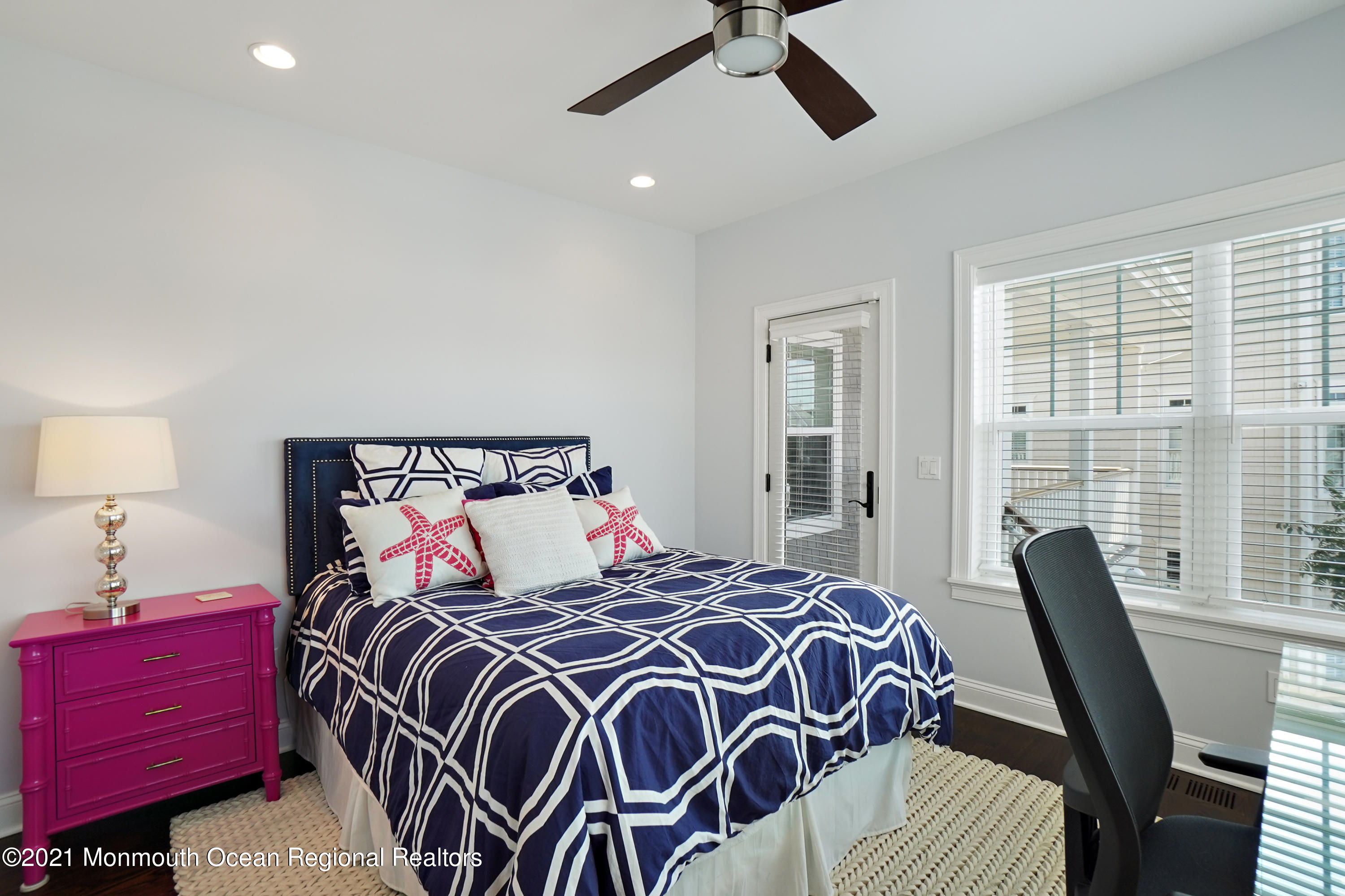 204 North Lagoon Road Lavallette, NJ 08735 - Photo 11 of 44 a bedroom with a bed and wooden floor