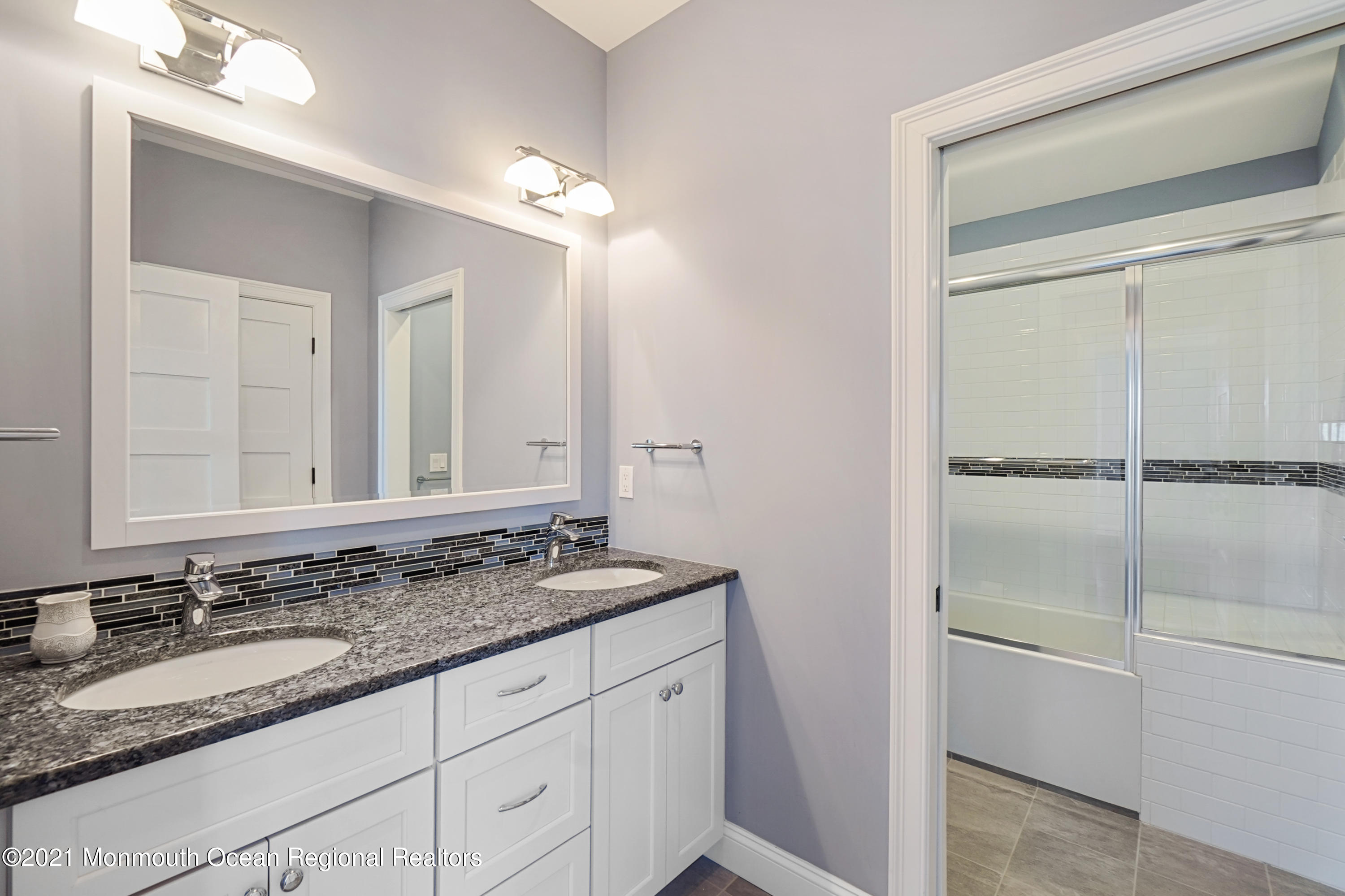 204 North Lagoon Road Lavallette, NJ 08735 - Photo 28 of 44 a bathroom with a granite countertop sink and a mirror
