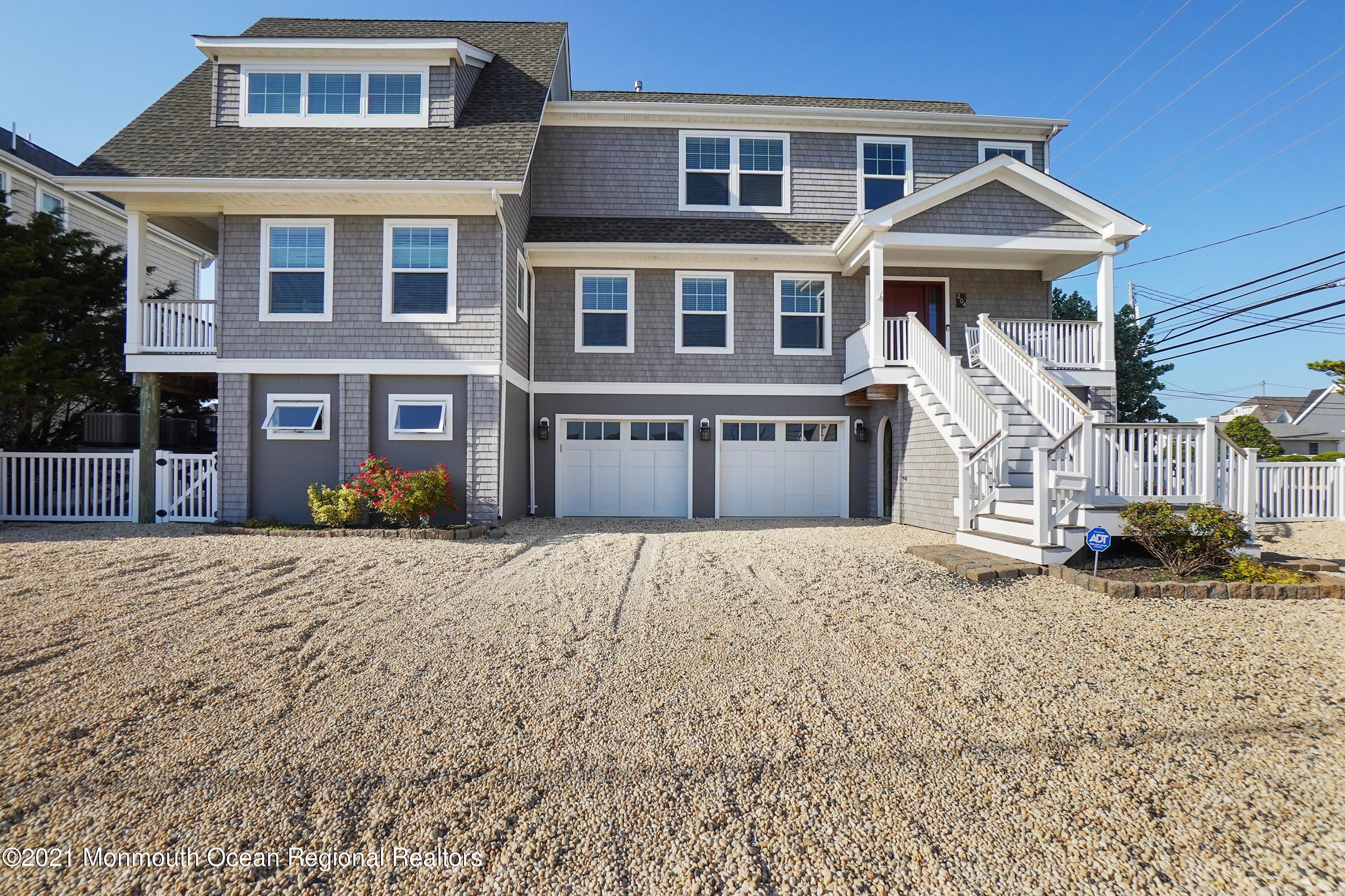 204 North Lagoon Road Lavallette, NJ 08735 - Photo 38 of 44 a front view of a house with a yard