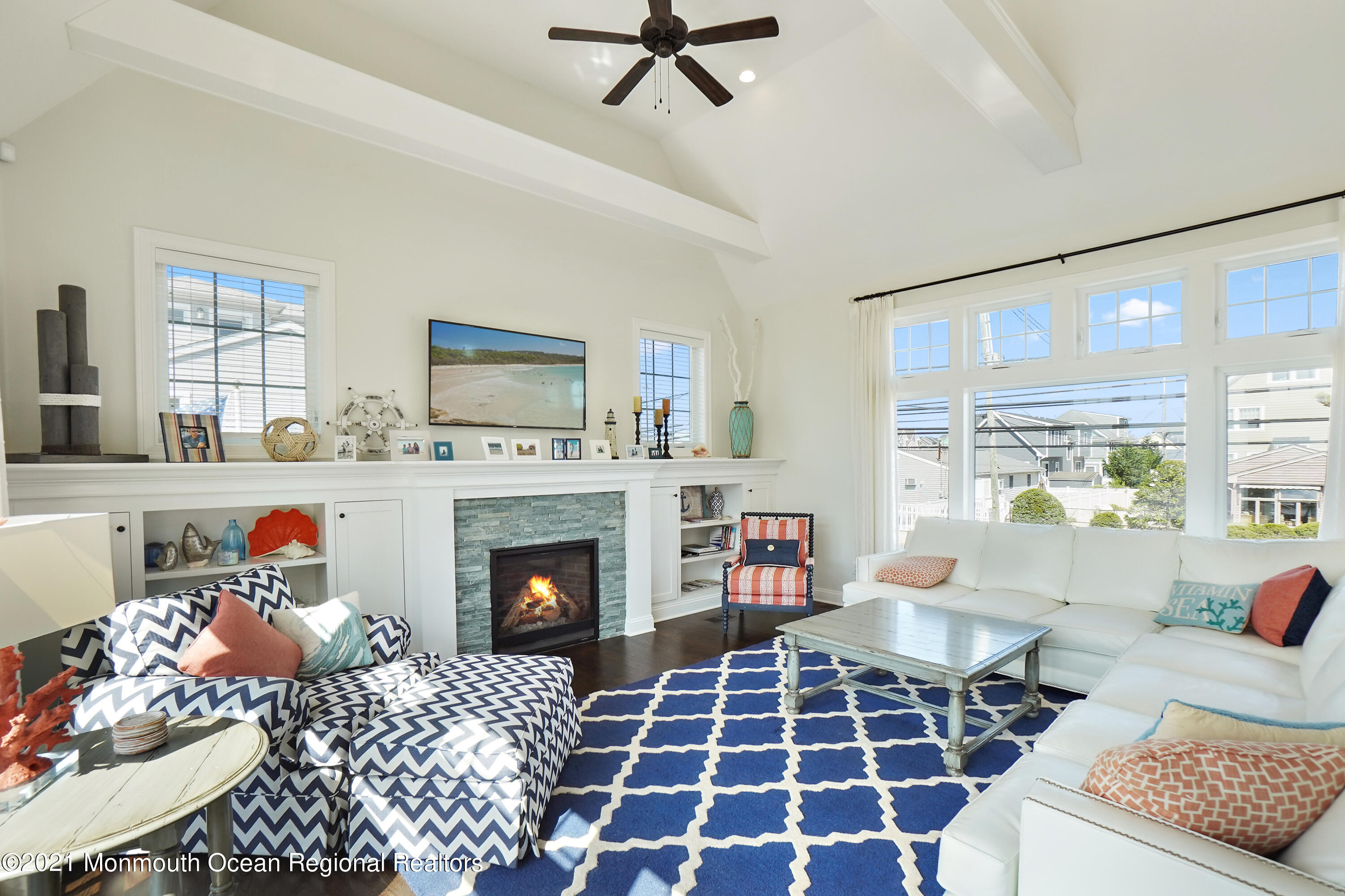 204 North Lagoon Road Lavallette, NJ 08735 - Photo 6 of 44 a living room with furniture a rug and a fireplace