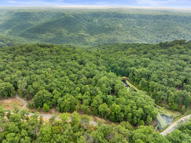 a view of a field with an outdoor space