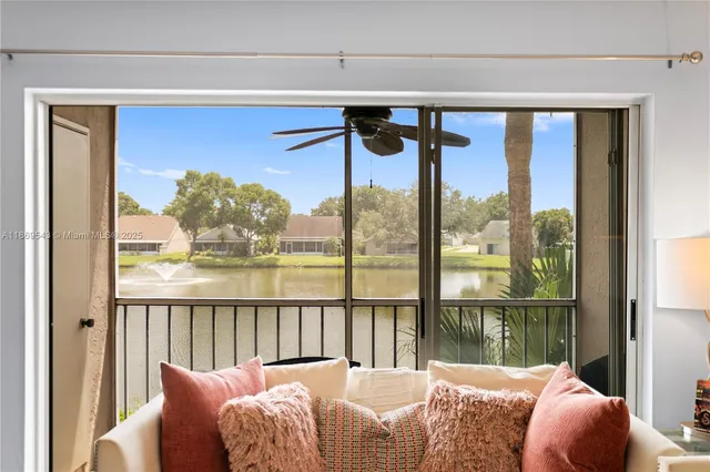 a bedroom with a large bed and a large window
