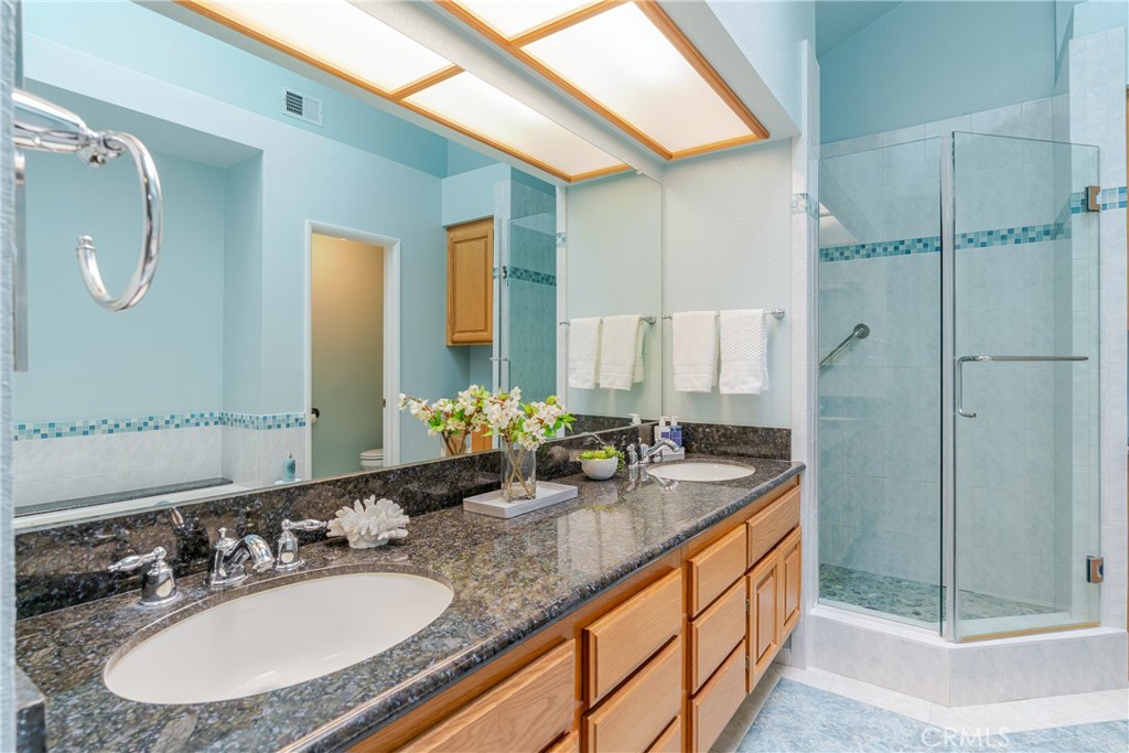 1049 Fairview Avenue, Unit 5 Arcadia, CA 91007 - Photo 15 of 26 a bathroom with a granite countertop sink and a mirror