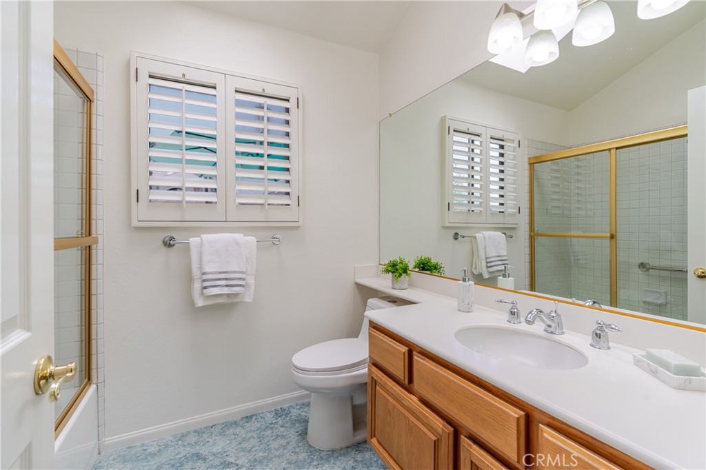 1049 Fairview Avenue, Unit 5 Arcadia, CA 91007 - Photo 19 of 26 a bathroom with a granite countertop sink toilet and mirror