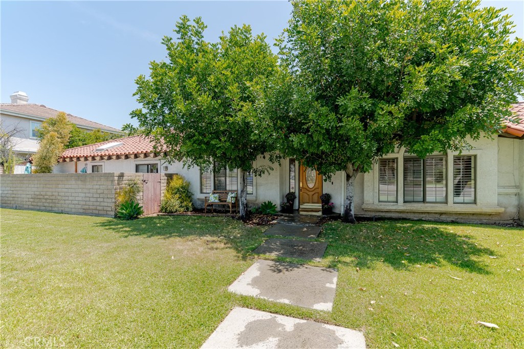 1049 Fairview Avenue, Unit 5 Arcadia, CA 91007 - Photo 2 of 26 a front view of a house with a yard