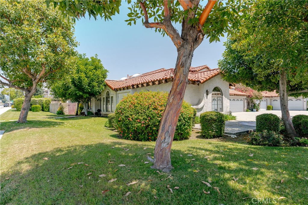1049 Fairview Avenue, Unit 5 Arcadia, CA 91007 - Photo 21 of 26 a front view of a house with garden