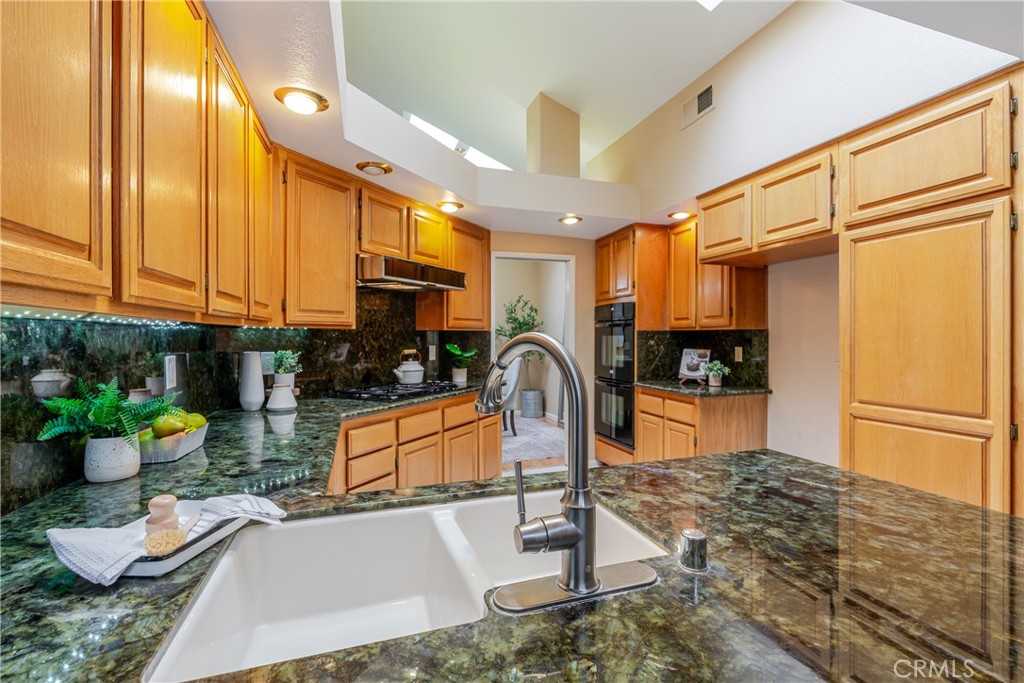 1049 Fairview Avenue, Unit 5 Arcadia, CA 91007 - Photo 7 of 26 a kitchen with stainless steel appliances granite countertop a refrigerator a stove and a sink