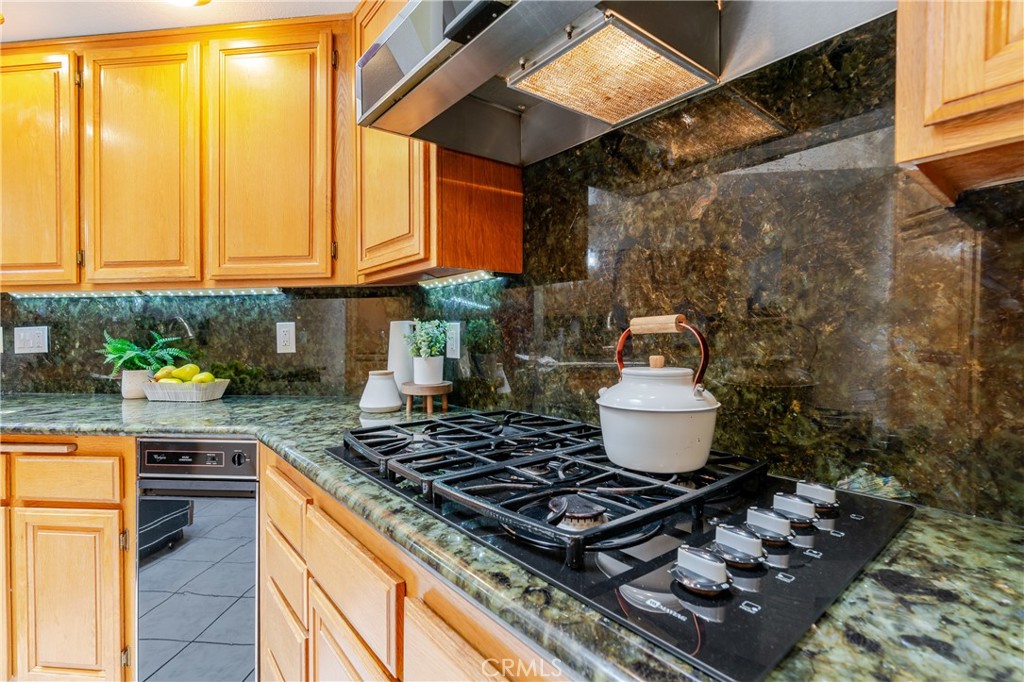 1049 Fairview Avenue, Unit 5 Arcadia, CA 91007 - Photo 9 of 26 a stove top oven sitting inside of a kitchen