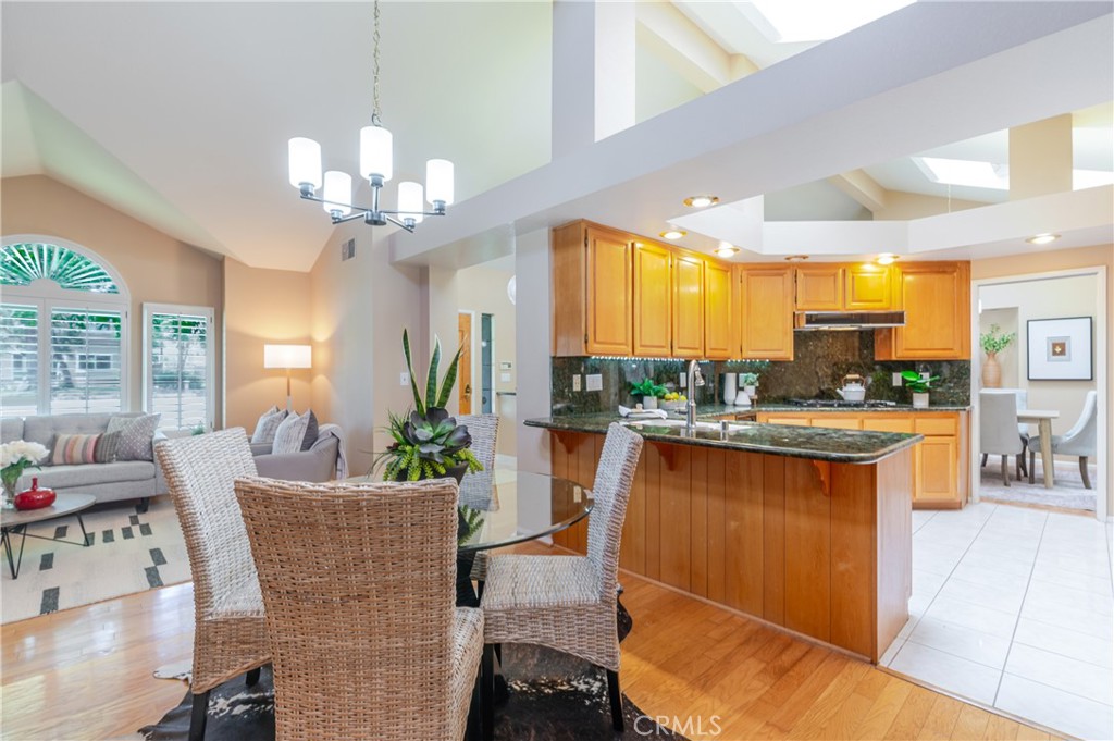 1049 Fairview Avenue, Unit 5 Arcadia, CA 91007 - Photo 10 of 26 a view of a dining room with furniture a kitchen and chandelier