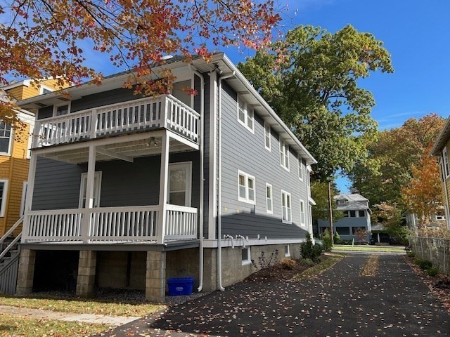 84 Aberdeen Avenue, Unit 1 Cambridge, MA 02138 - Photo 17 of 17 a front view of a house with a yard